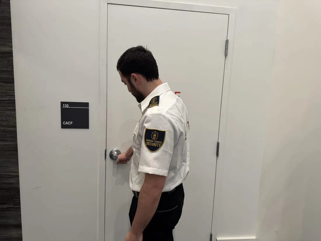 Guard Tower Security guard checking a door lock during an access control round