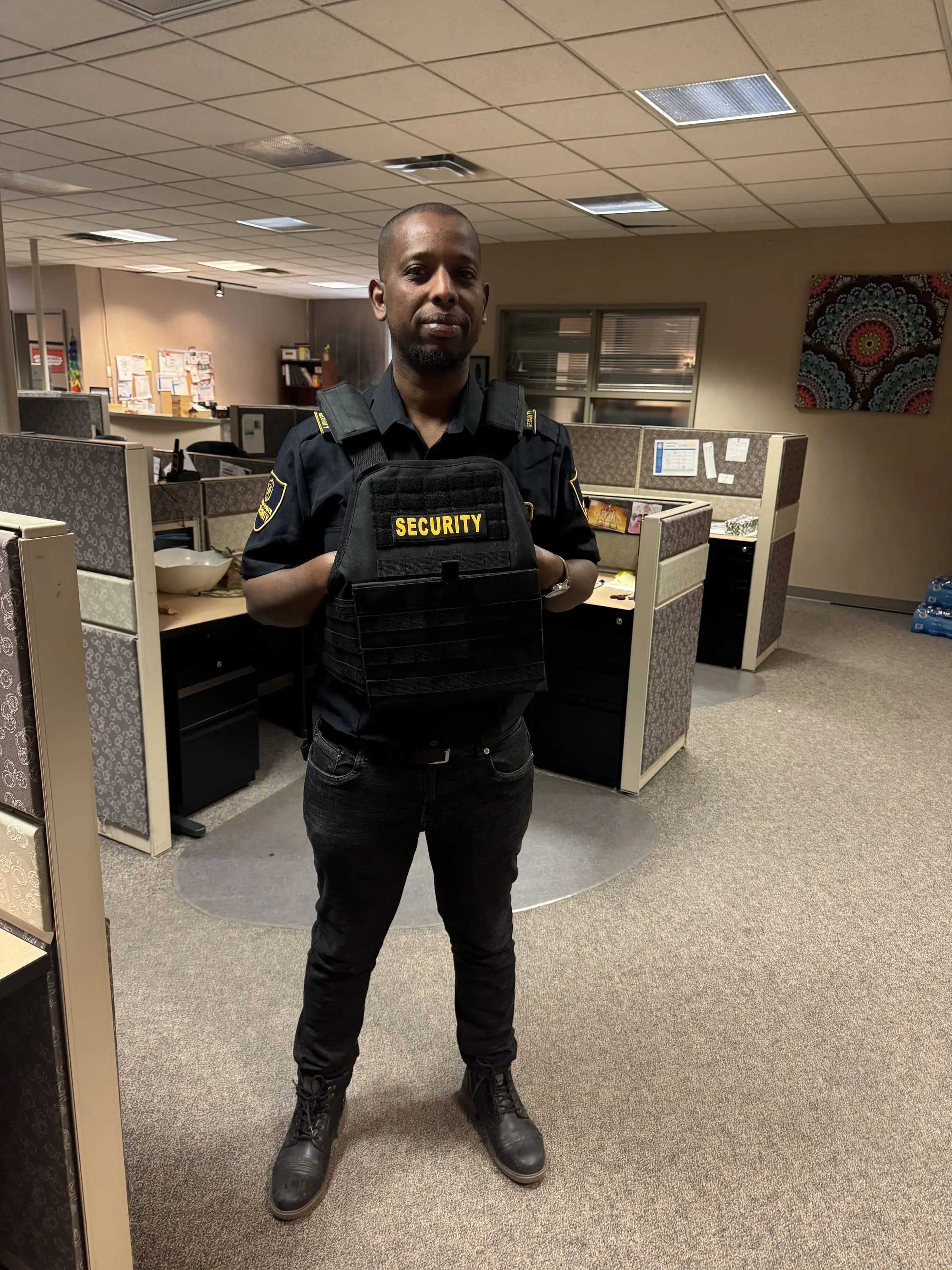 Uniformed Guard Tower Security guard in protective vest at a Calgary corporate office