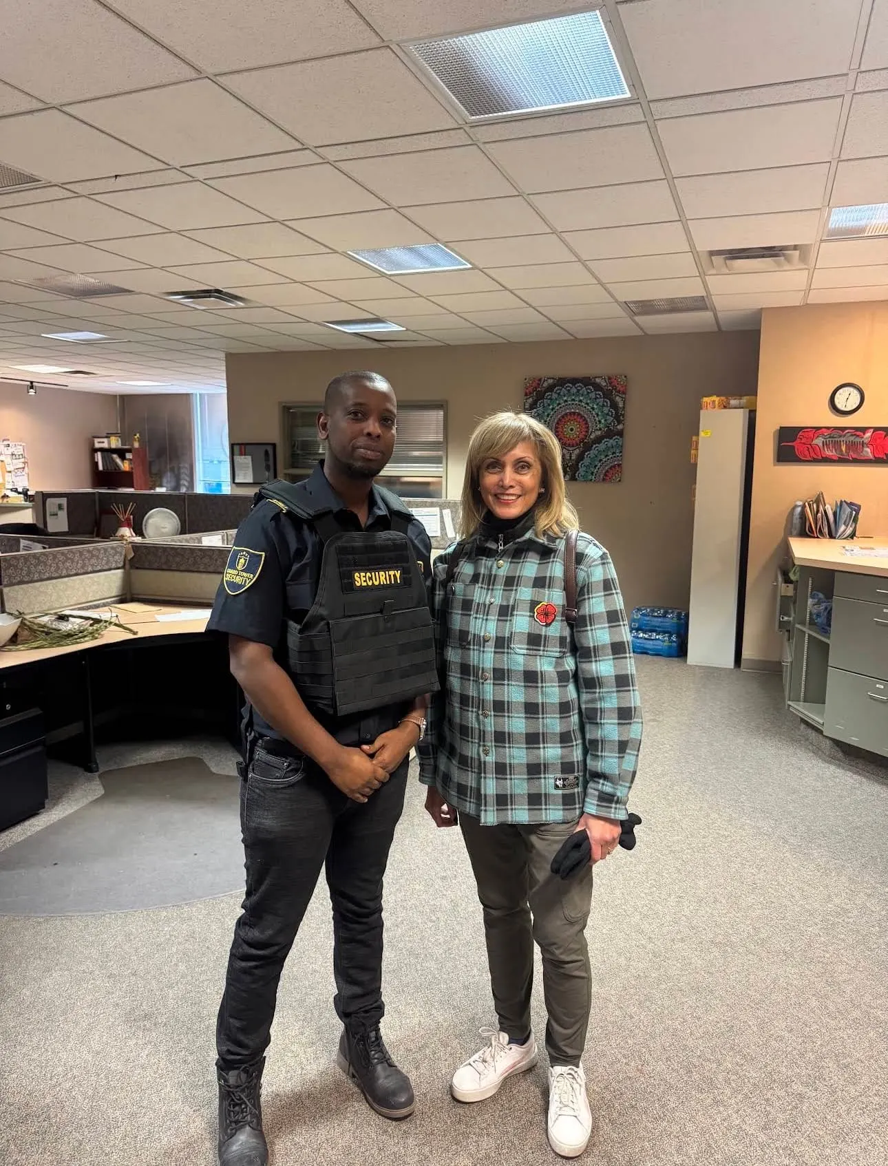 Guard Tower Security guard assisting a client at a Calgary office