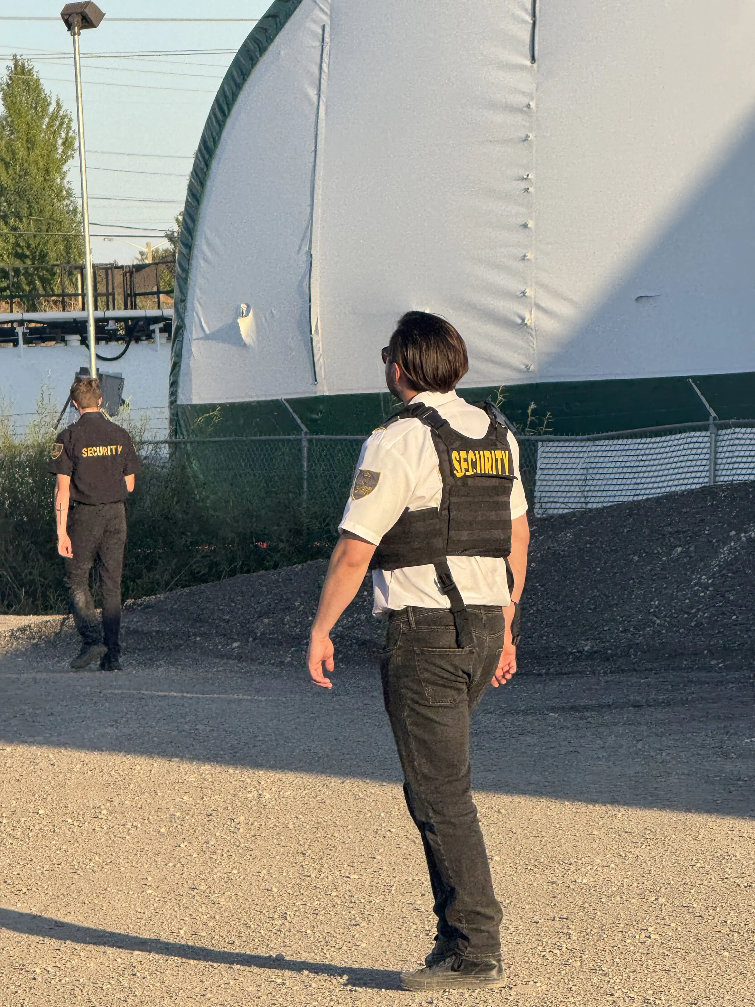 Guard Tower Security guard on a perimeter fire watch check at an industrial facility