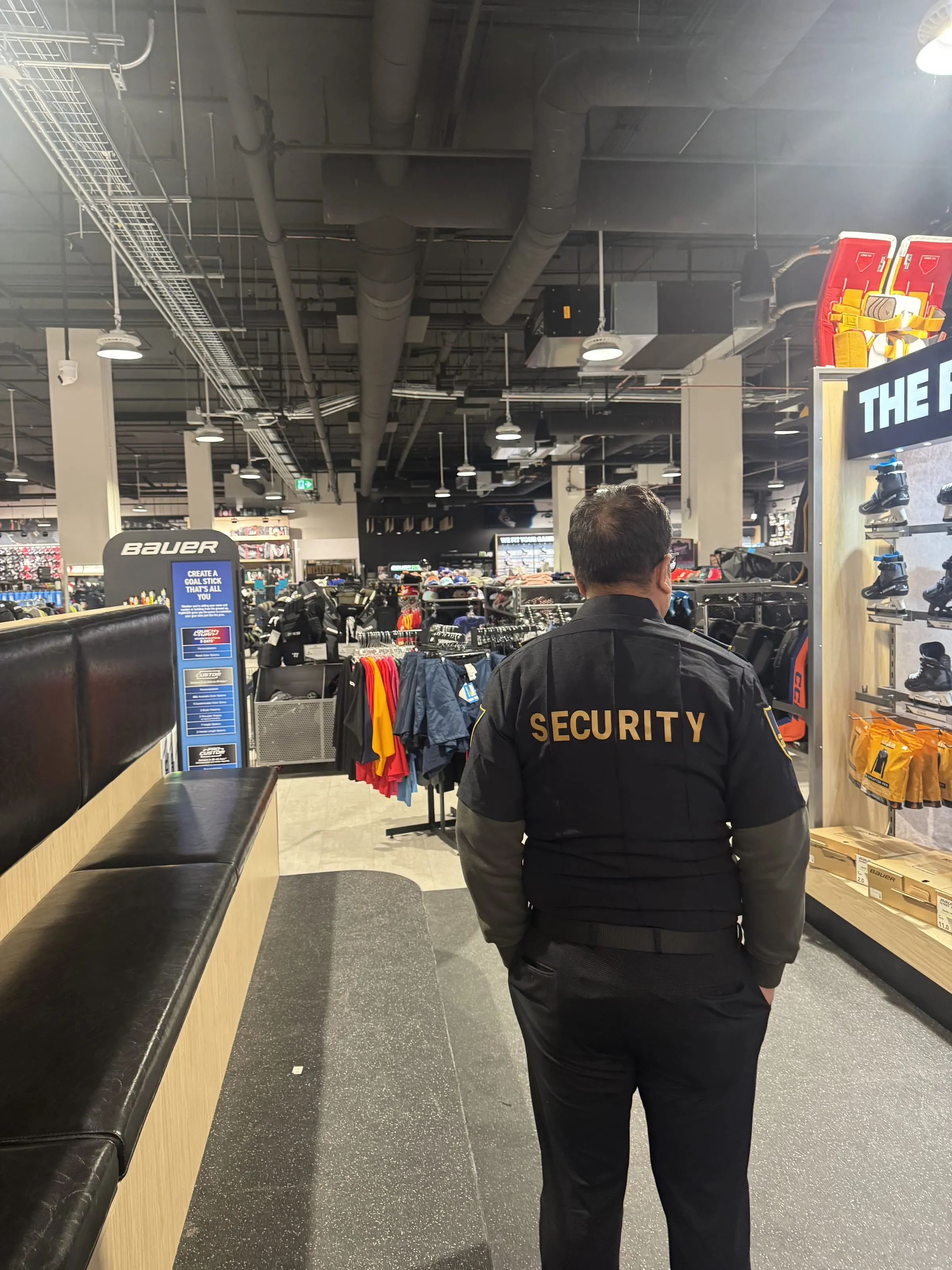 Guard Tower Security loss prevention guard patrolling a Calgary sporting goods store
