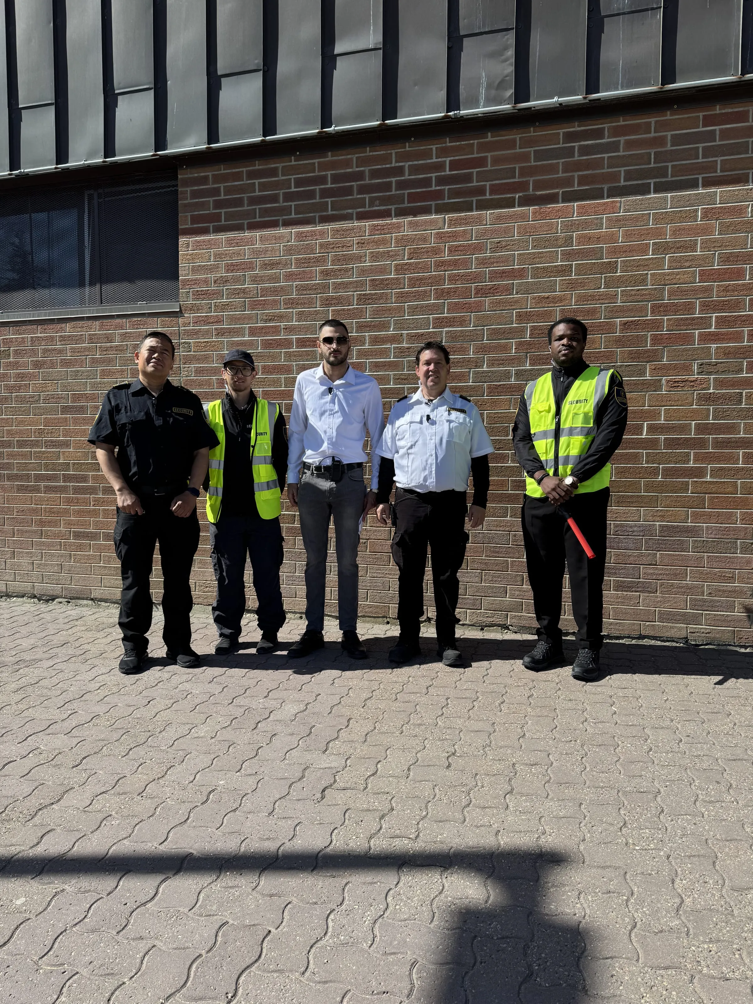 Uniformed Guard Tower Security team in high-visibility vests