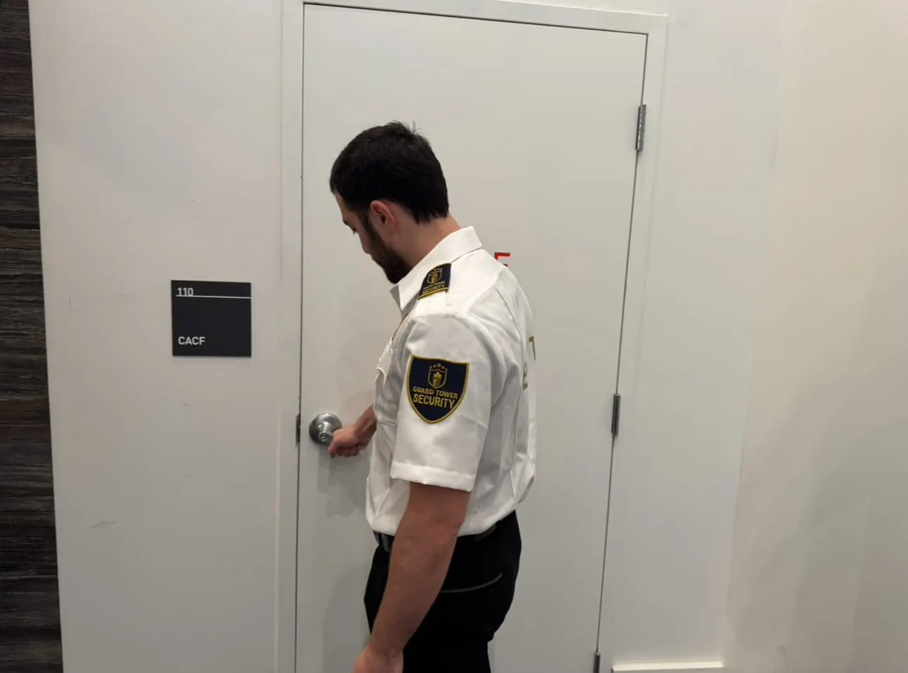 Guard Tower Security officer securing a facility door